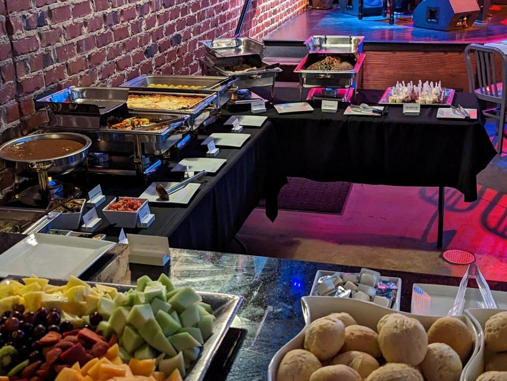 Catered buffet set up against the exposed brick wall at Bobby McKey's